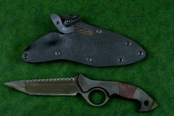 "Ari B'Lilah" counterterrorism, tactical, combat knife, obverse side view in T4 cryogenically treated 440C high chromium martensitic stainless steel blade, 304 stainless steel bolsters, red/black  G10 handle, hybrid tension tab locking sheath in kydex, anodized aluminum, anodized titanium, black oxide stainless steel