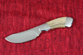 "Kochab" obverse side view in T3 deep cryogenically processed 440C high chromium martensitic stainless steel blade, 304 stainless steel bolsters, Petrified Sycamore Wood gemstone handle, sheath of lizard skin inlaid in hand-carved leather shoulder, nylon 