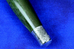 "Daqar" Custom handmade dagger, engraved stainless steel pommel detail view ,  in T4 deep cryogenically treated CPM 154CM Powder metal technology martensitic stainless steel blade, hand-engraved, 304 austenitic stainless steel fittings, hand-engraved, nephrite jade gemstone handle, hand-carved leather sheath inlaid with American Bison skin