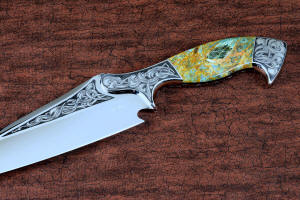 "Malaka" fine custom handmade knife, obverse side engraving detail  in hand-engraved CPM 154CM powder metal technology stainless steel, T4 deep cryogenically treated, bolsters of hand-engraved 304 stainless steel, Plasma agate and Nephrite Jade gemstone handle, hand-carved leather crossdraw sheath with stainless steel hardware